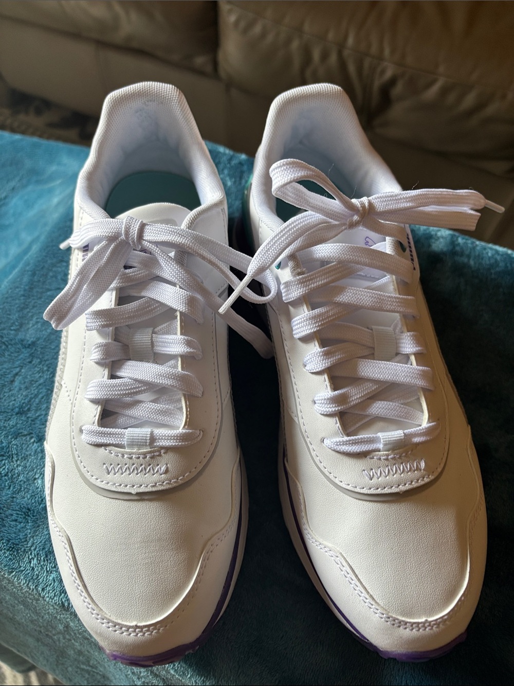 Puma Women's White Lace-Up Sneakers with Purple Sole Accents